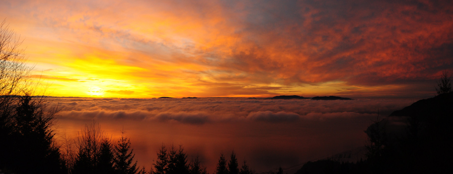 Sunset from Samish Overlook, with fog and San Juan Islands in the background.
