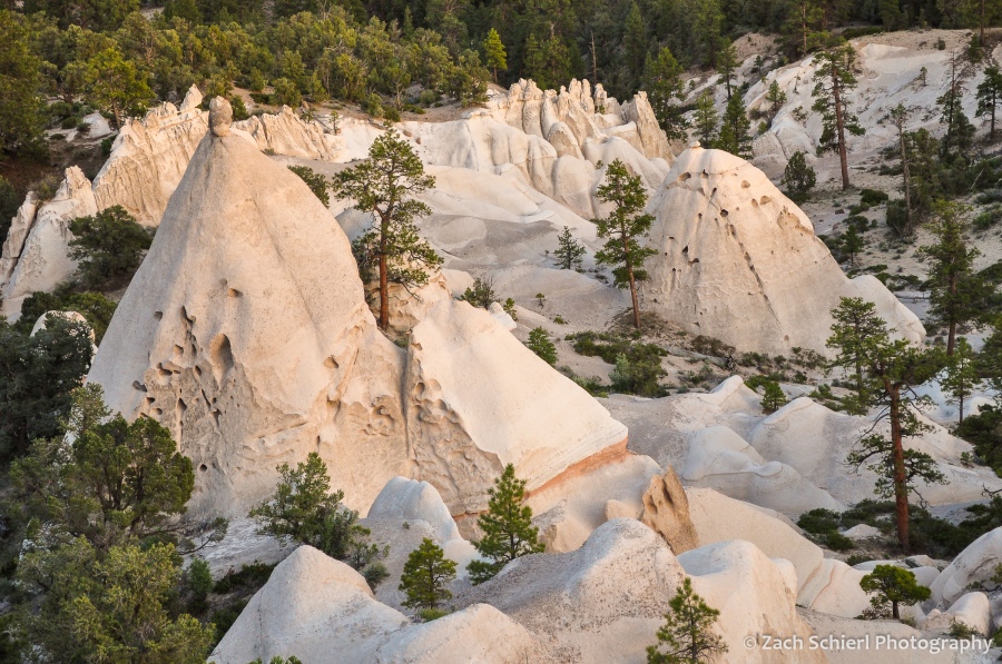 Pyramid-shaped white cliffs of tuff in golden sunset light
